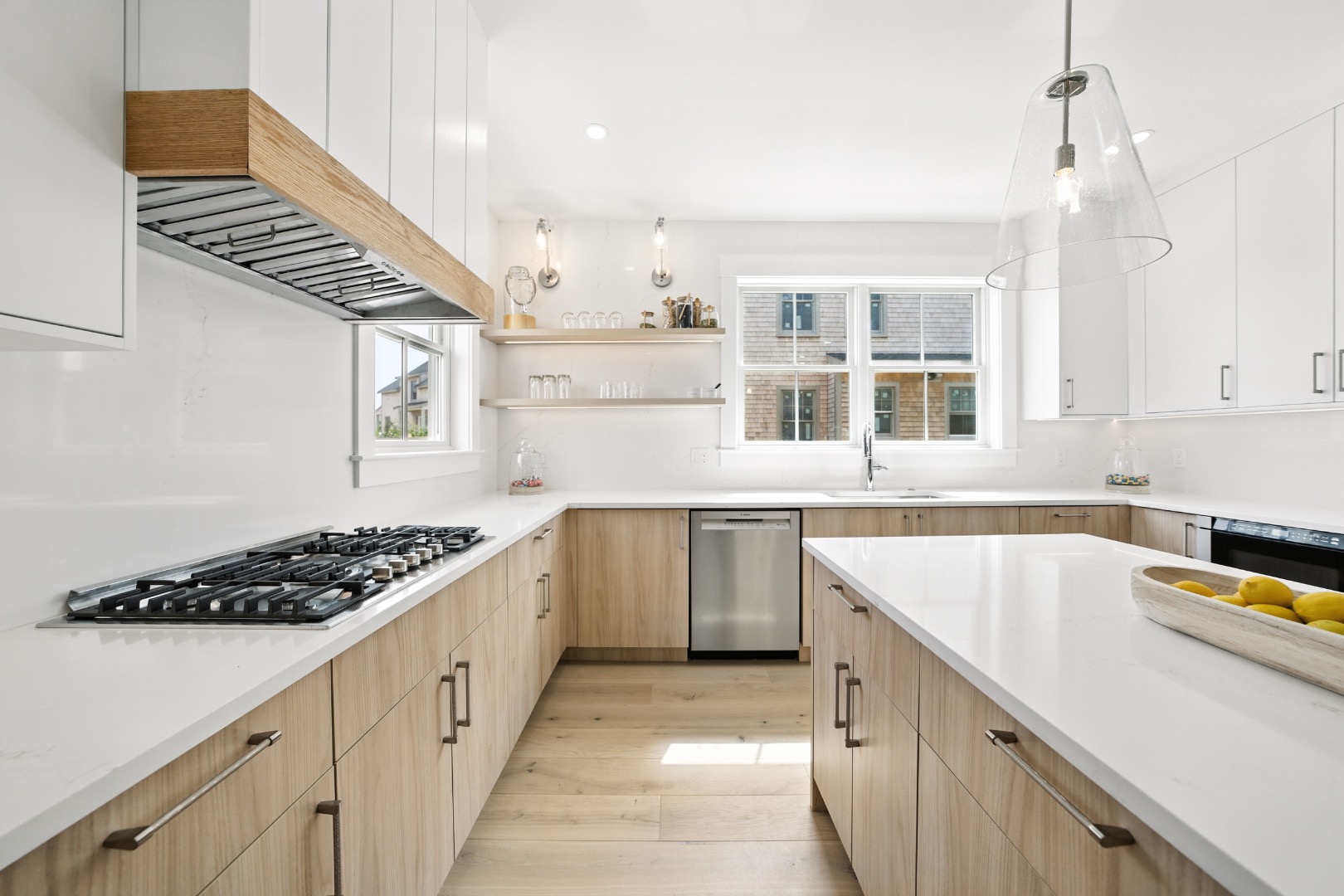 10 Beach Grass Road Nantucket, MA 02554 - Photo 7 of 29 a kitchen with stainless steel appliances a sink and stove