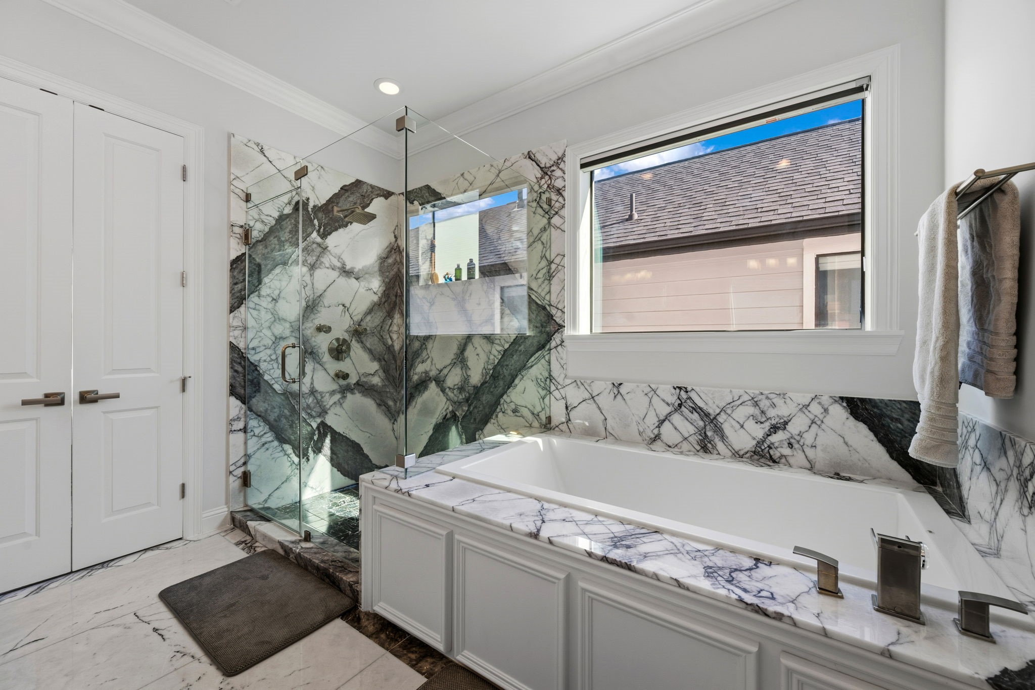 1235 West Bell Street, Unit A Houston, TX 77019 - Photo 16 of 38 a bathroom with a granite countertop sink a mirror and shower