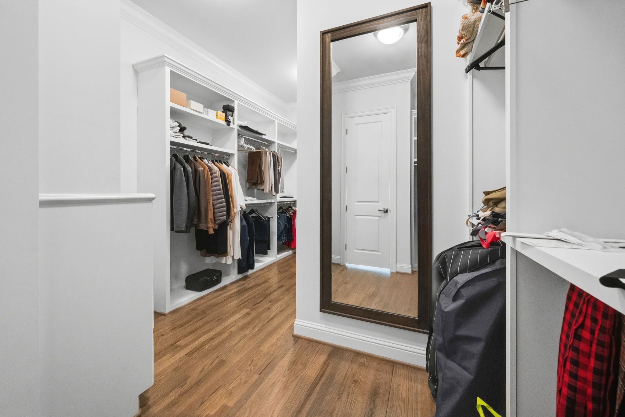 1235 West Bell Street, Unit A Houston, TX 77019 - Photo 17 of 38 Expansive primary closet with ample storage.
