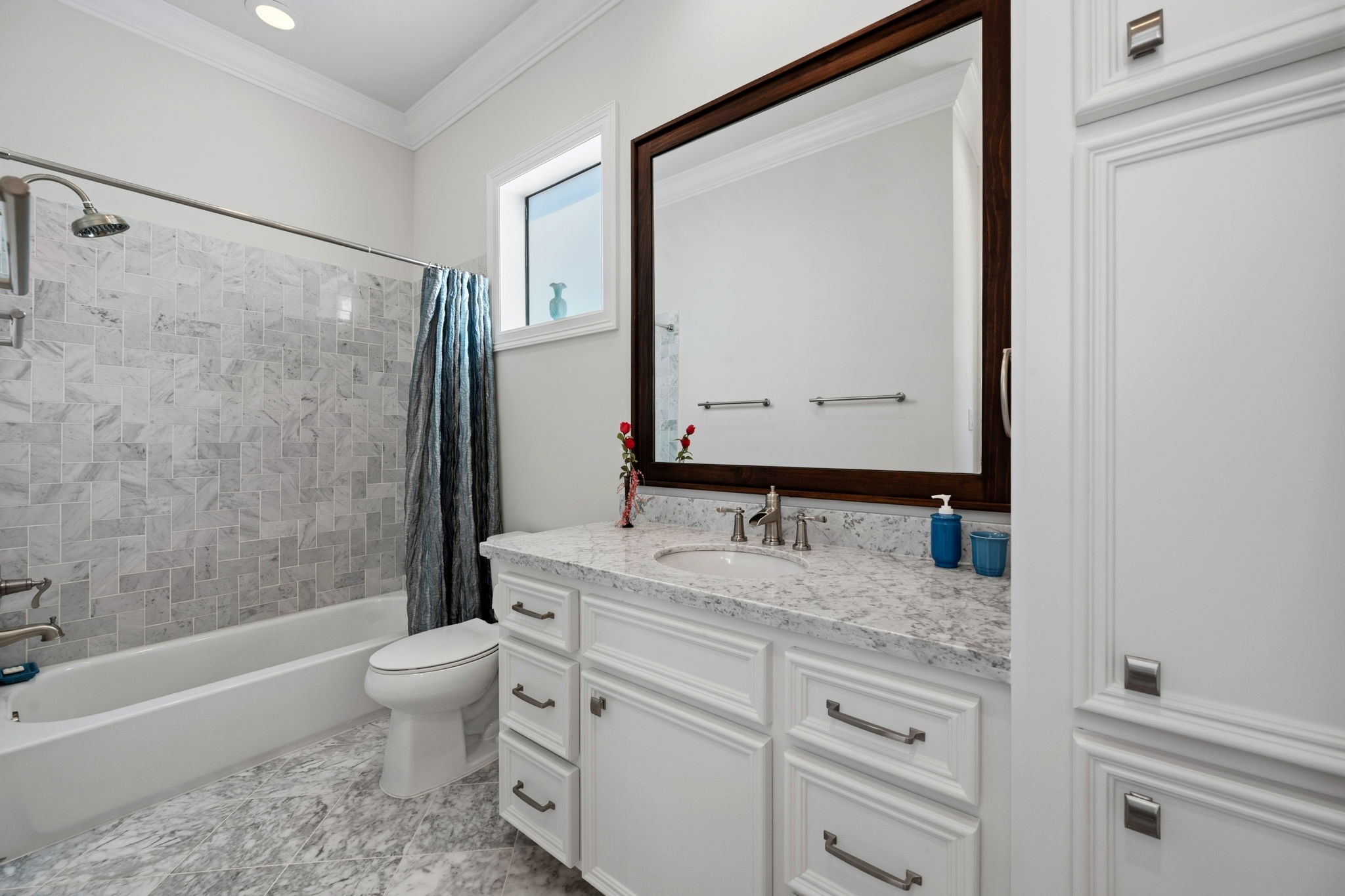 1235 West Bell Street, Unit A Houston, TX 77019 - Photo 20 of 38 Elegant second full bath featuring a shower/tub combo, stunning tile work, and natural light.