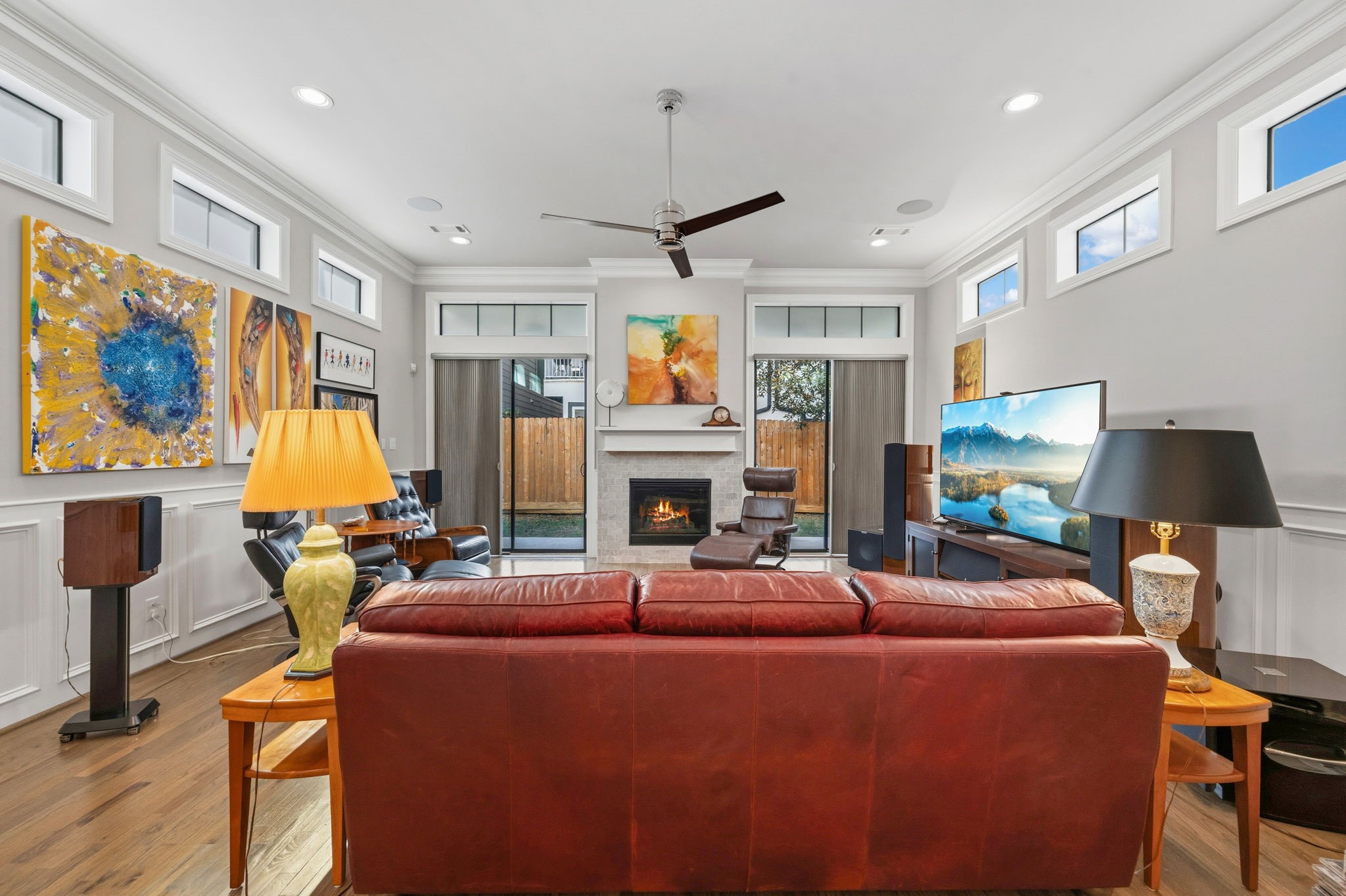 1235 West Bell Street, Unit A Houston, TX 77019 - Photo 2 of 38 a living room with furniture a fireplace and a flat screen tv