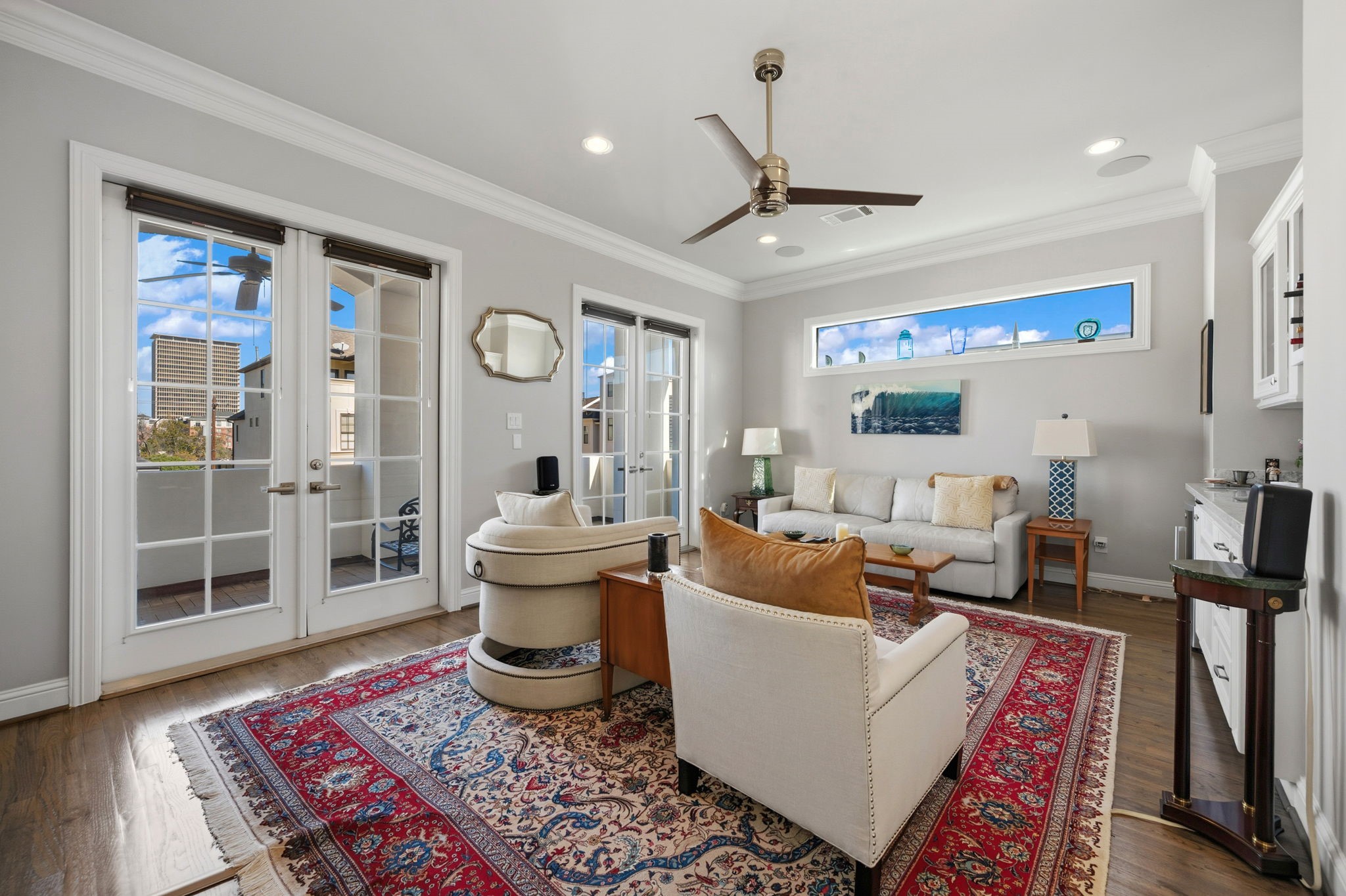 1235 West Bell Street, Unit A Houston, TX 77019 - Photo 21 of 38 Bright family room with French doors leading to a charming balcony.