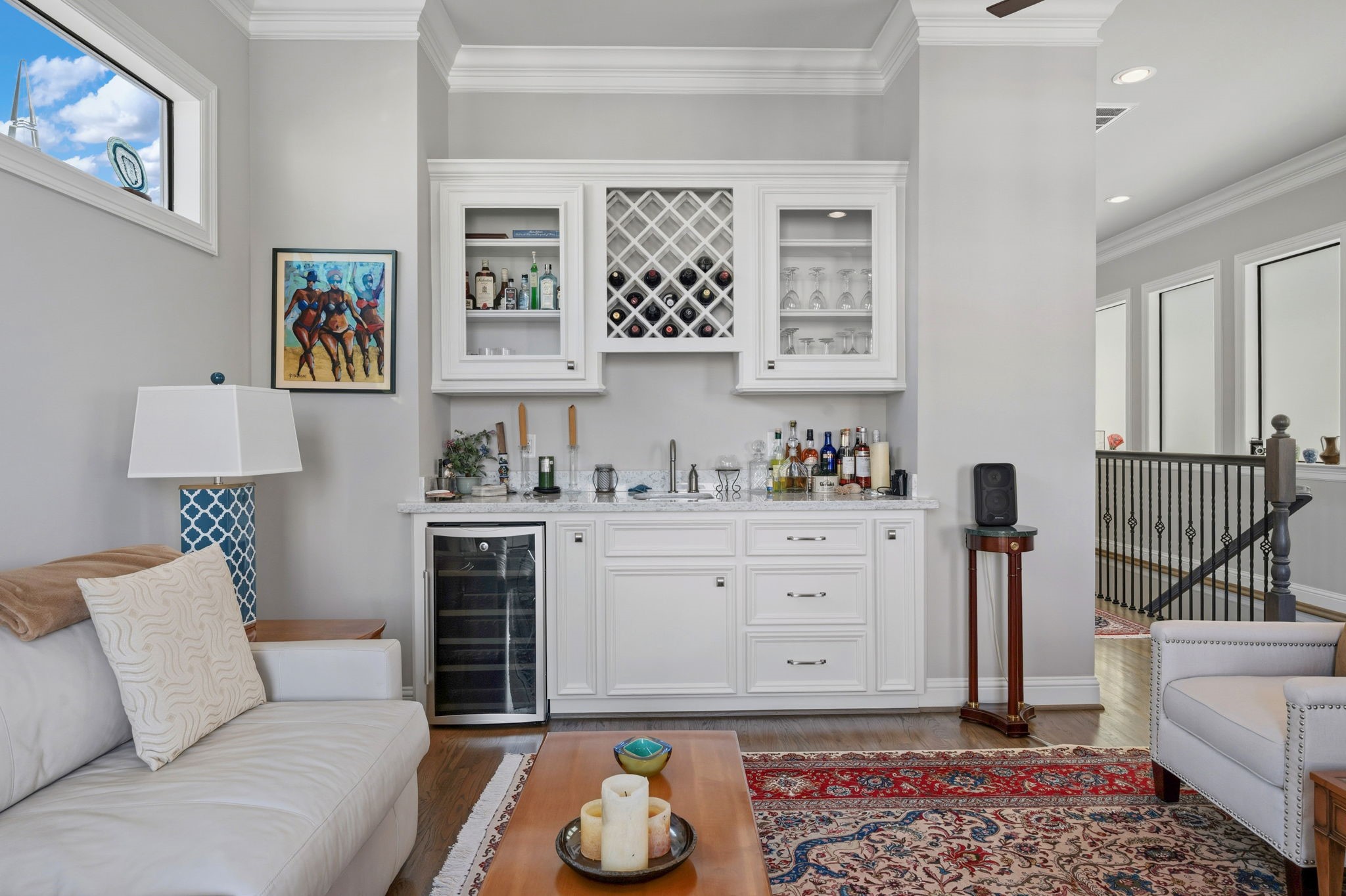 1235 West Bell Street, Unit A Houston, TX 77019 - Photo 23 of 38 Elegant family room wet bar with ample storage, perfect for entertaining.