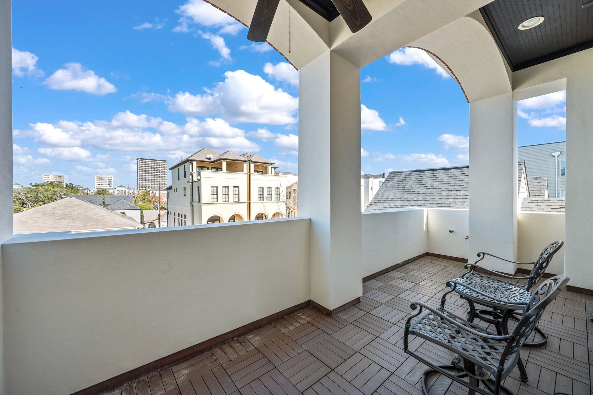 1235 West Bell Street, Unit A Houston, TX 77019 - Photo 25 of 38 Elegant arches and modern ceiling fans enhance the charm and comfort of this space.