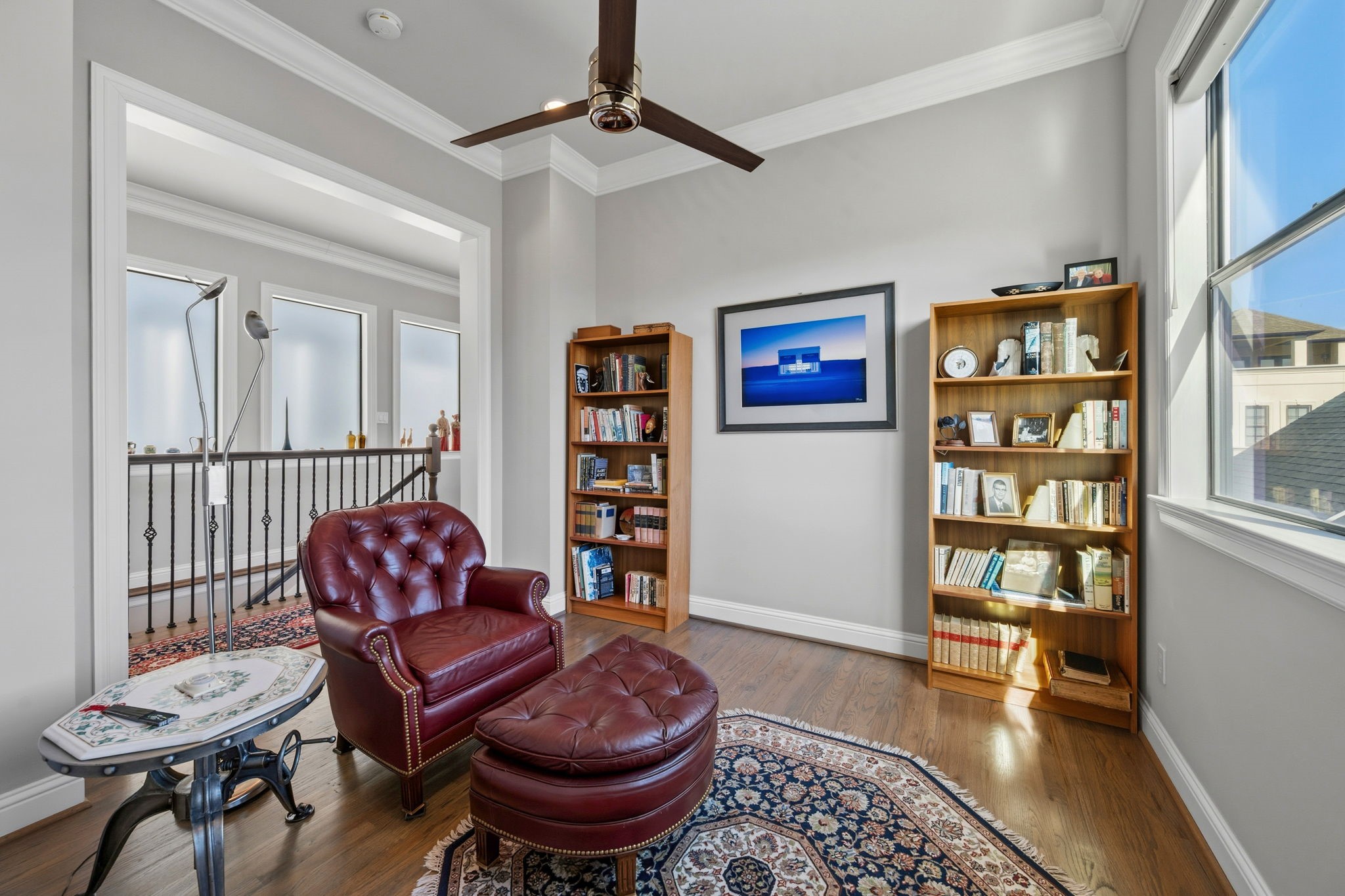 1235 West Bell Street, Unit A Houston, TX 77019 - Photo 27 of 38 a living room with furniture and a book shelf