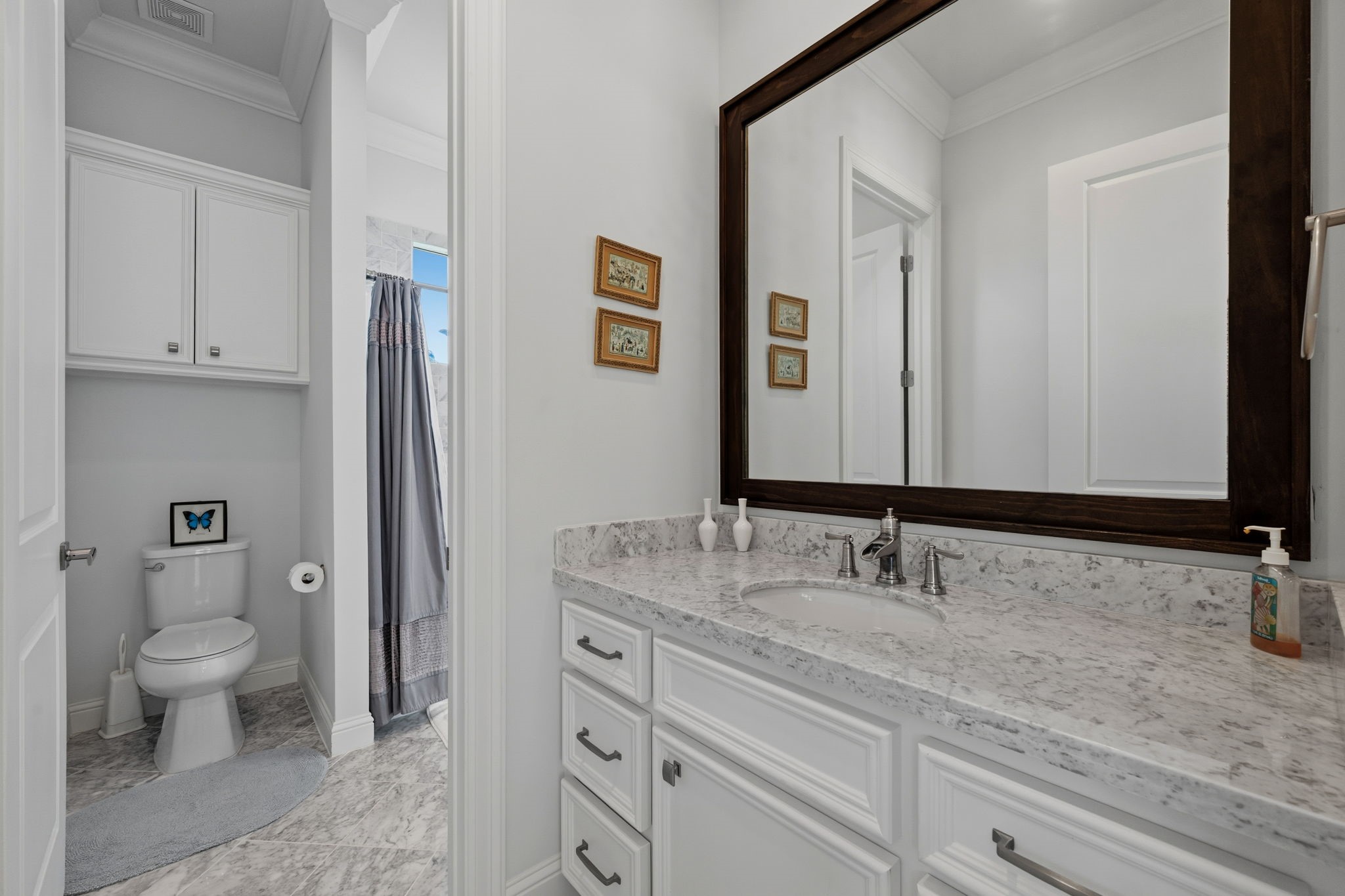 1235 West Bell Street, Unit A Houston, TX 77019 - Photo 28 of 38 a bathroom with a granite countertop sink and a mirror