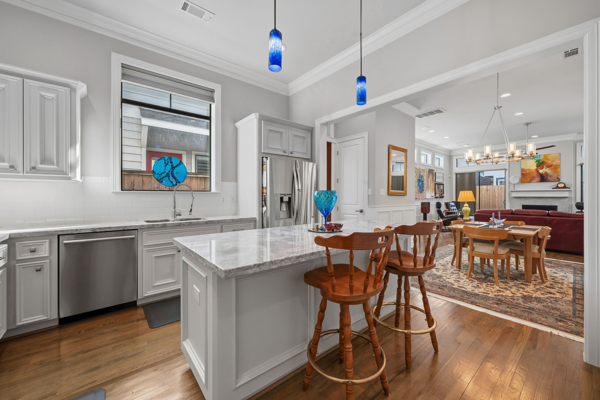1235 West Bell Street, Unit A Houston, TX 77019 - Photo 4 of 38 Stunning kitchen featuring elegant hand-blown glass pendant lights.