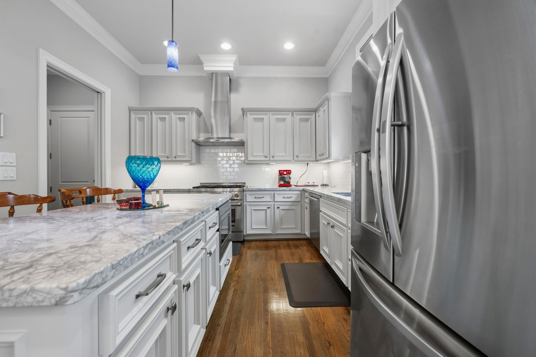 1235 West Bell Street, Unit A Houston, TX 77019 - Photo 7 of 38 The kitchen offers easy access from both the garage and side door.