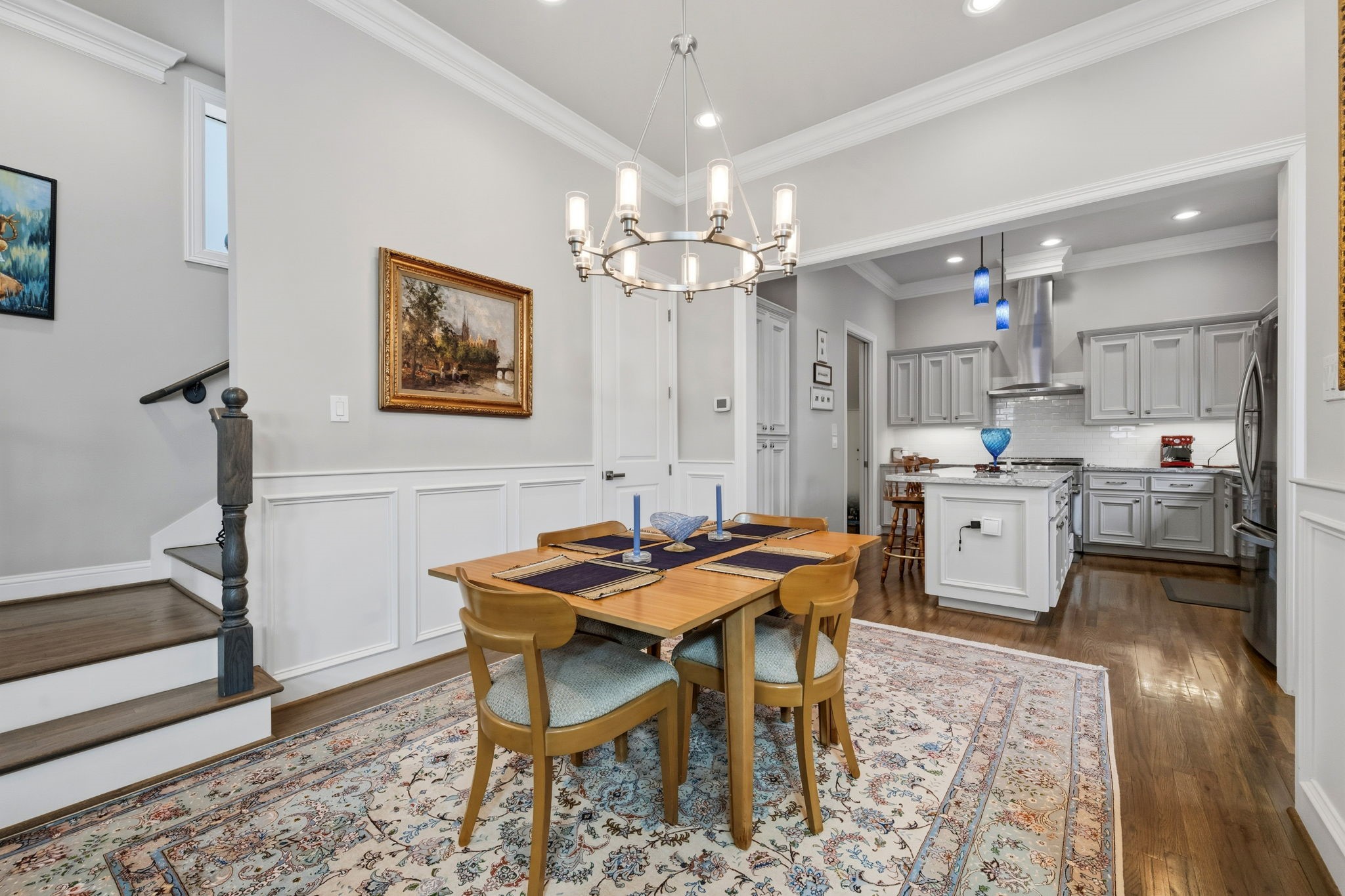 1235 West Bell Street, Unit A Houston, TX 77019 - Photo 9 of 38 a view of a dining room with furniture and a chandelier