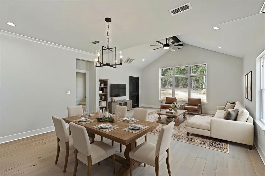 335 Perdanales Bullard, TX 75757 - Photo 16 of 37 a living room with furniture a window and a chandelier