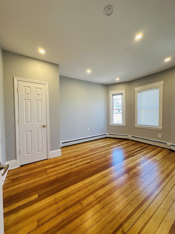 28 Melbourne Street, Unit 3 Boston, MA 02124 - Photo 9 of 27 a view of empty room with wooden floor and fan