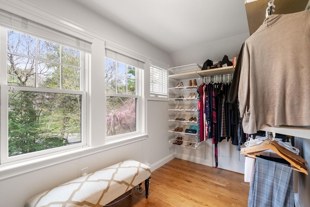 4 Pond Brook Circle Weston, MA 02493 - Photo 17 of 35 a view of a bedroom with a bed and a window