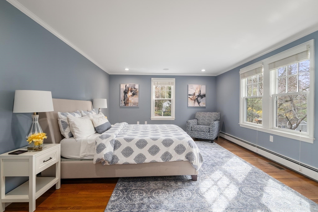 4 Pond Brook Circle Weston, MA 02493 - Photo 23 of 35 a bedroom with a large bed and a window