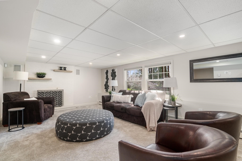 4 Pond Brook Circle Weston, MA 02493 - Photo 24 of 35 a living room with furniture and a large window