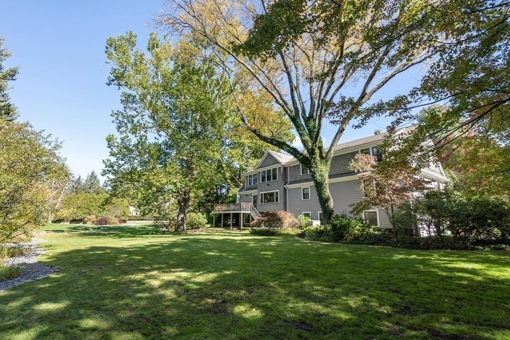 4 Pond Brook Circle Weston, MA 02493 - Photo 29 of 35 a view of a house with a big yard and large trees