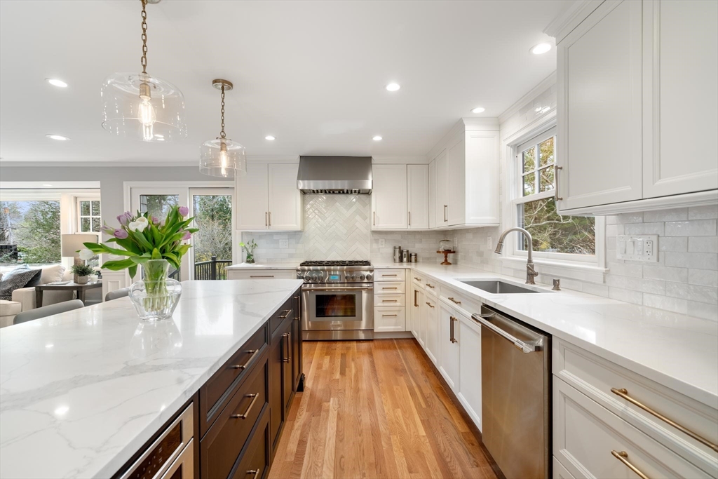 4 Pond Brook Circle Weston, MA 02493 - Photo 8 of 35 a kitchen with a sink stove and cabinets