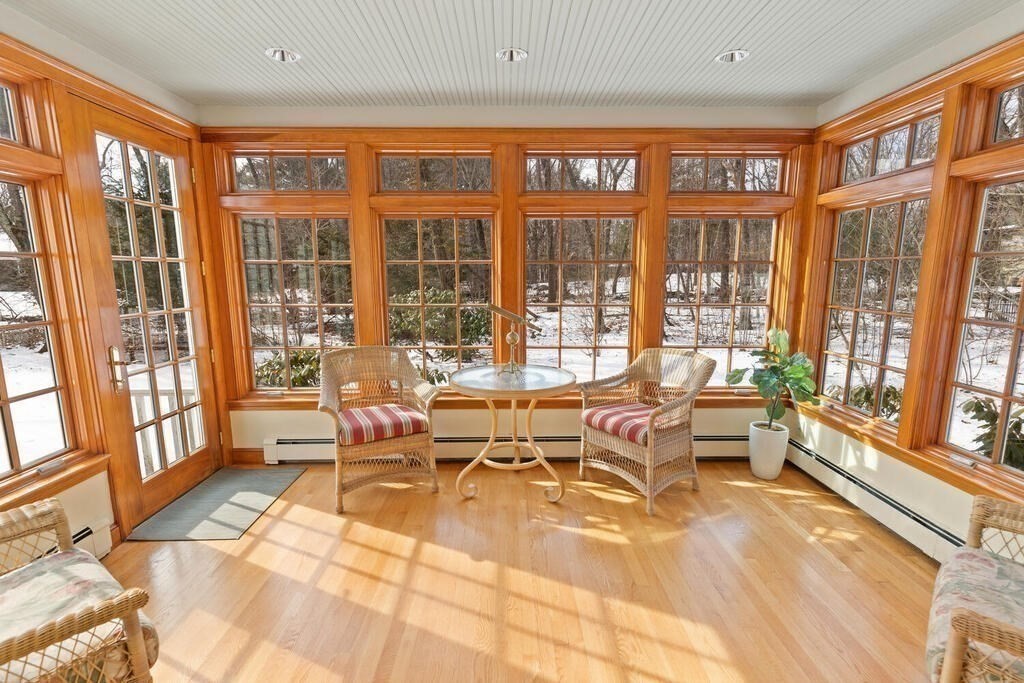 73 Thornberry Road Winchester, MA 01890 - Photo 18 of 39 a living room with furniture and a floor to ceiling window