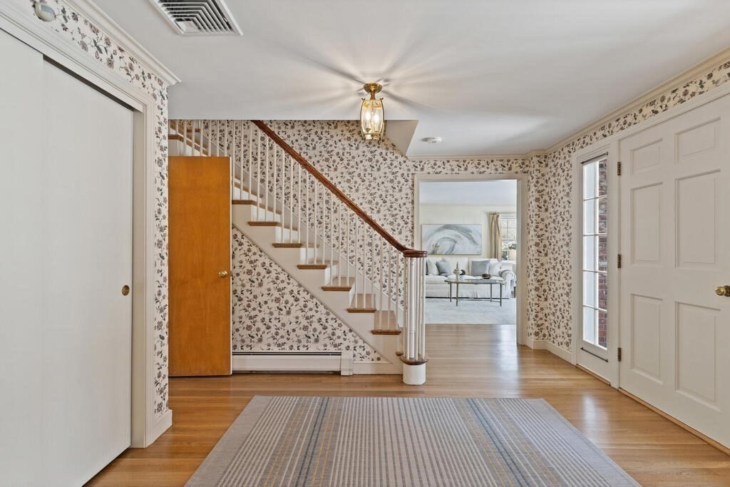 73 Thornberry Road Winchester, MA 01890 - Photo 21 of 39 a view of entryway and hall with wooden floor