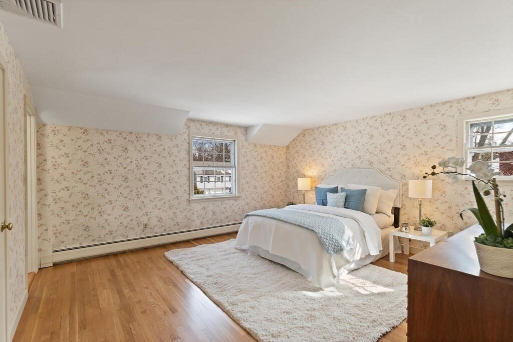 73 Thornberry Road Winchester, MA 01890 - Photo 23 of 39 a bedroom with a bed and wooden floor