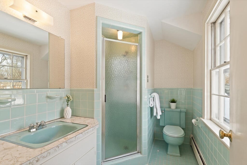 73 Thornberry Road Winchester, MA 01890 - Photo 24 of 39 a bathroom with a granite countertop sink a toilet and shower
