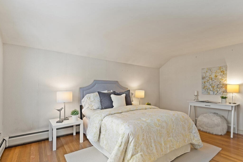 73 Thornberry Road Winchester, MA 01890 - Photo 25 of 39 a bedroom with a bed and a chair