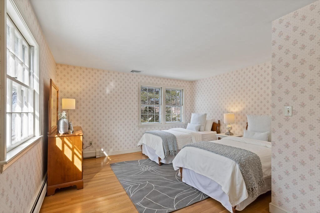 73 Thornberry Road Winchester, MA 01890 - Photo 27 of 39 a bedroom with two beds and a couch next to a window