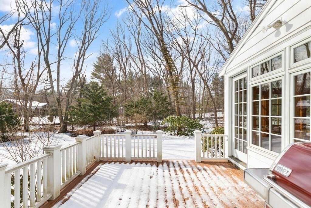 73 Thornberry Road Winchester, MA 01890 - Photo 33 of 39 a view of a wooden fence and trees