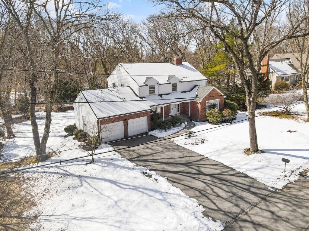 73 Thornberry Road Winchester, MA 01890 - Photo 34 of 39 a view of a backyard that has a tree on the side of it