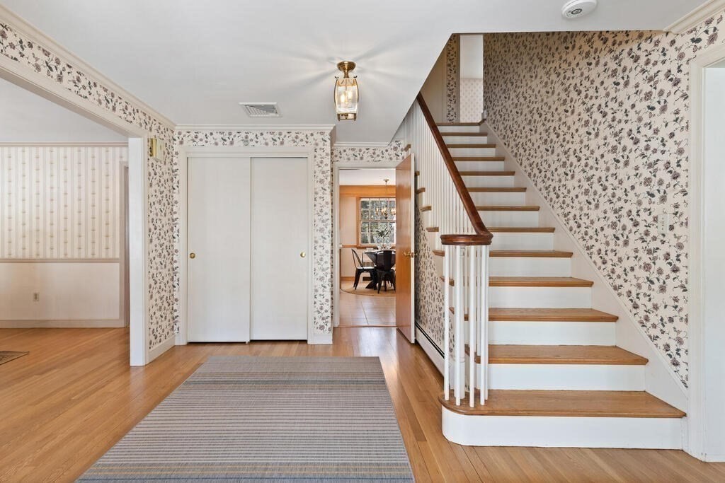 73 Thornberry Road Winchester, MA 01890 - Photo 5 of 39 a view of a hallway with wooden floor and entryway