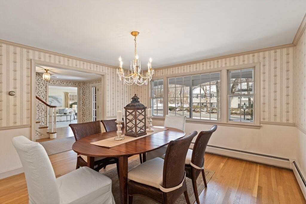 73 Thornberry Road Winchester, MA 01890 - Photo 9 of 39 a view of a dining room with furniture wooden floor and chandelier