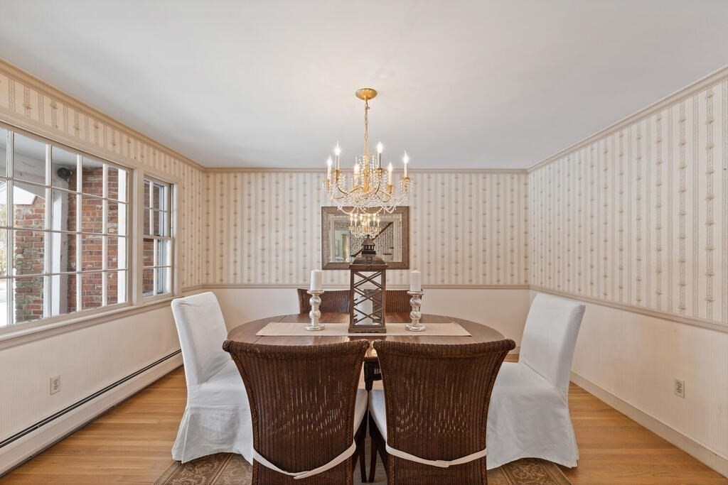 73 Thornberry Road Winchester, MA 01890 - Photo 10 of 39 a dining room with furniture a chandelier and wooden floor