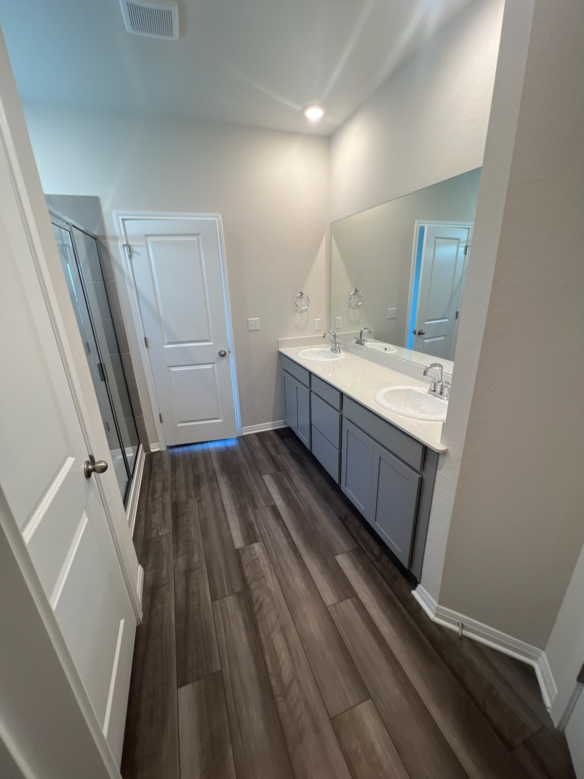 6400 Rounded Pebble Lane Buda, TX 78610 - Photo 13 of 34 a bathroom with a sink a mirror and a toilet