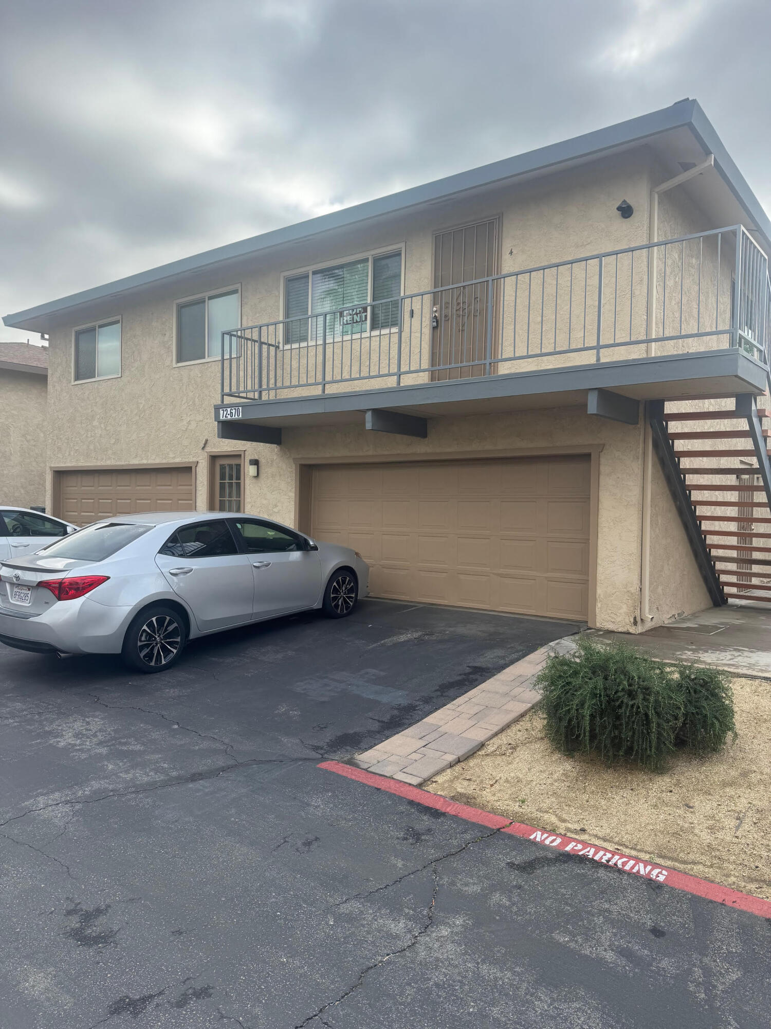 72670 Thrush Road, Unit 4 Palm Desert, CA 92260 - Photo 2 of 7 a living room with a couch and a window