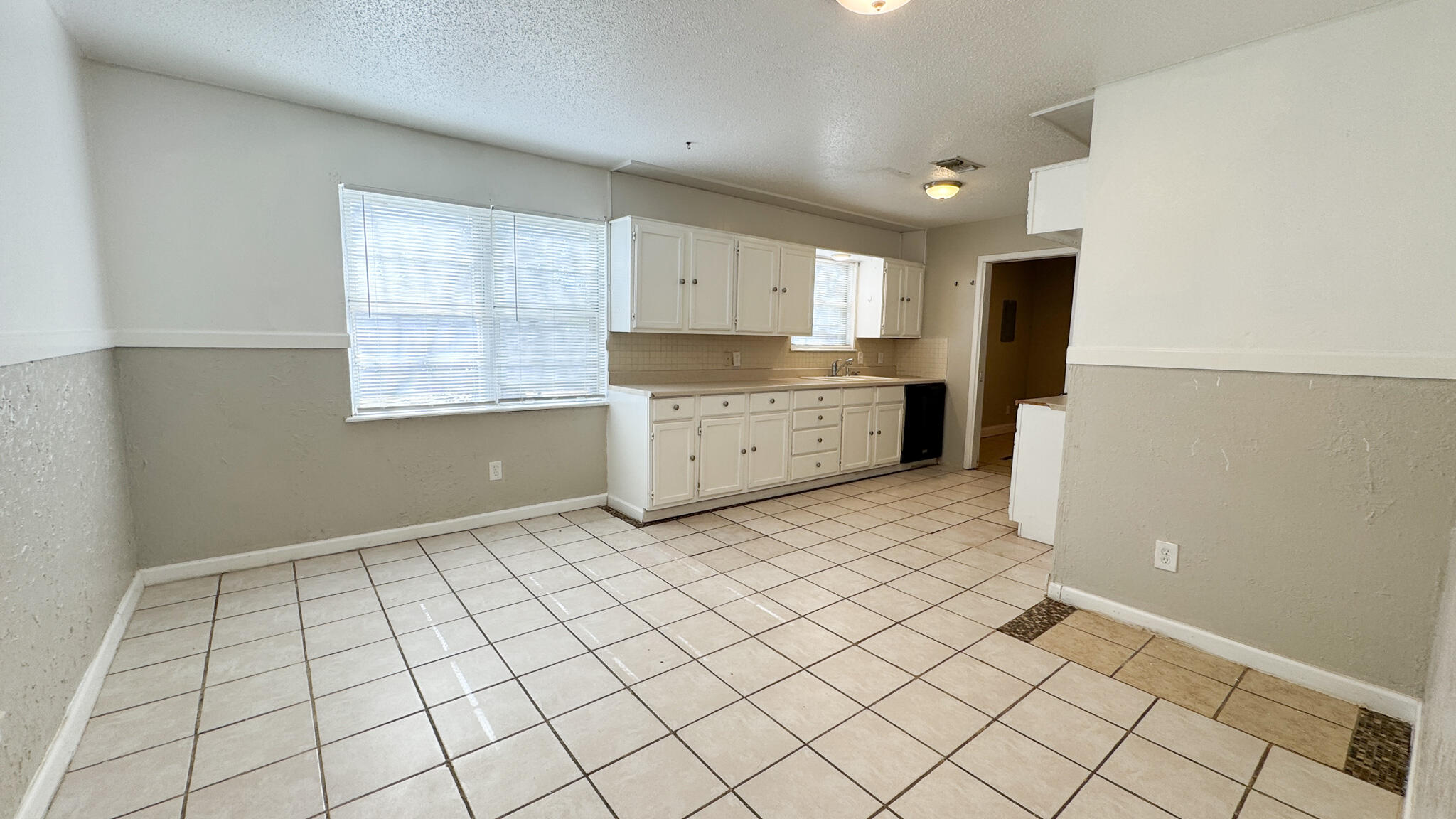 4825 53rd Street Lubbock, TX 79414 - Photo 4 of 13 a room with a cabinets and appliances