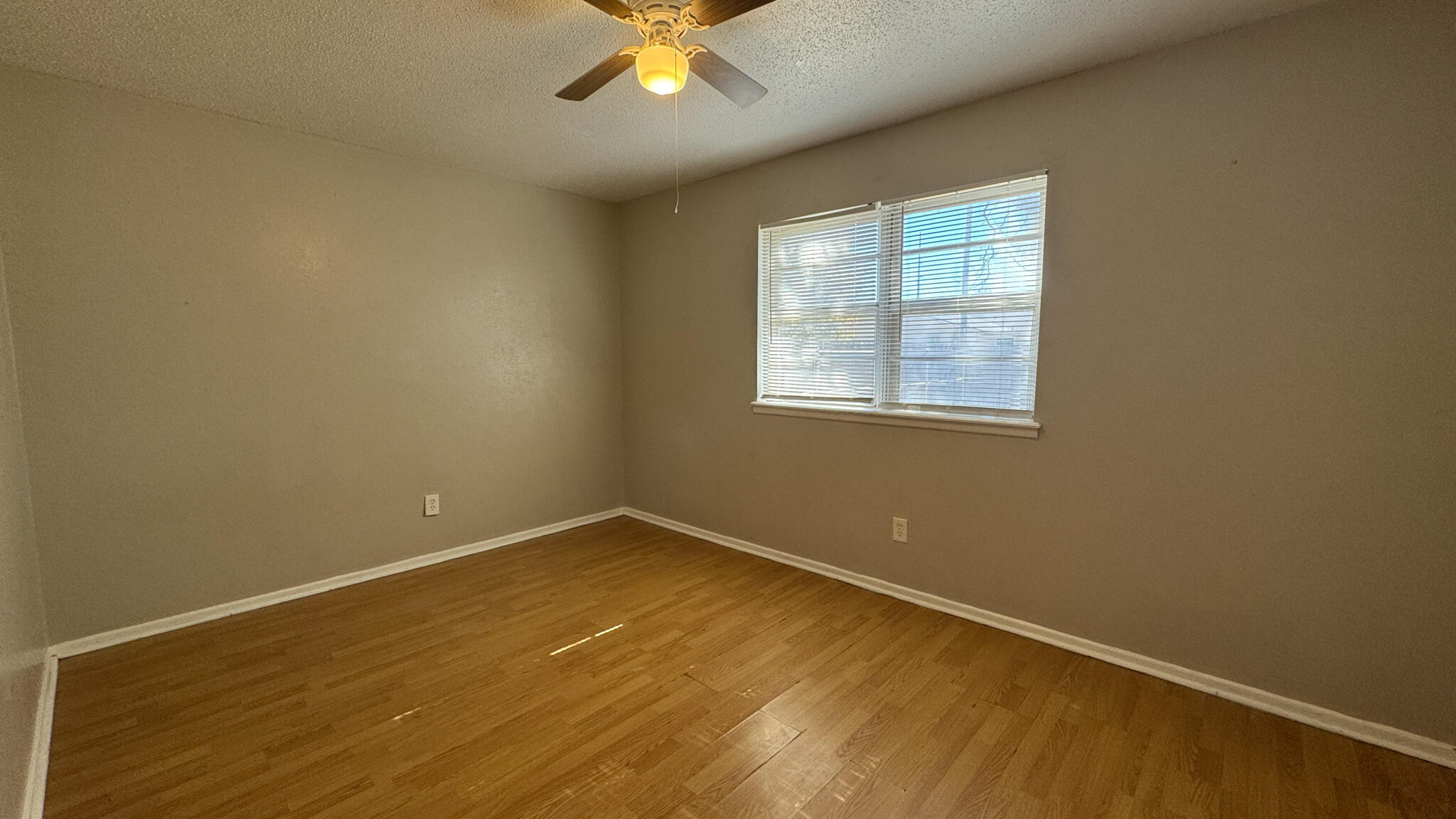 4825 53rd Street Lubbock, TX 79414 - Photo 7 of 13 an empty room with a window