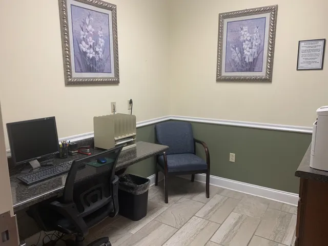 a view of a workspace with furniture