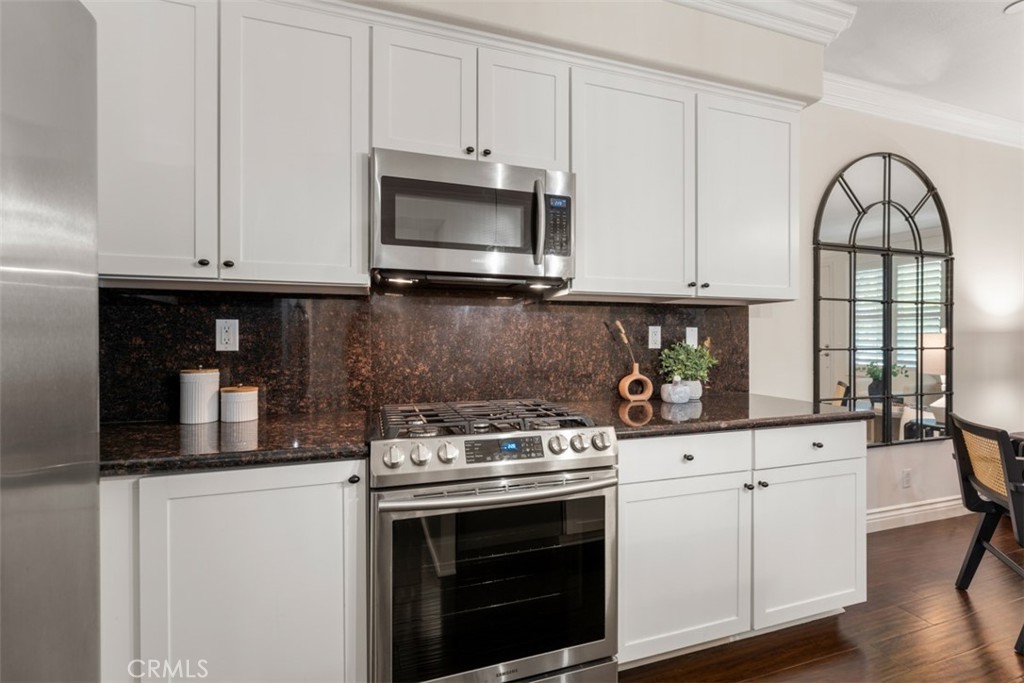 46 Platinum Circle Ladera Ranch, CA 92694 - Photo 11 of 37 a kitchen with white cabinets and appliances