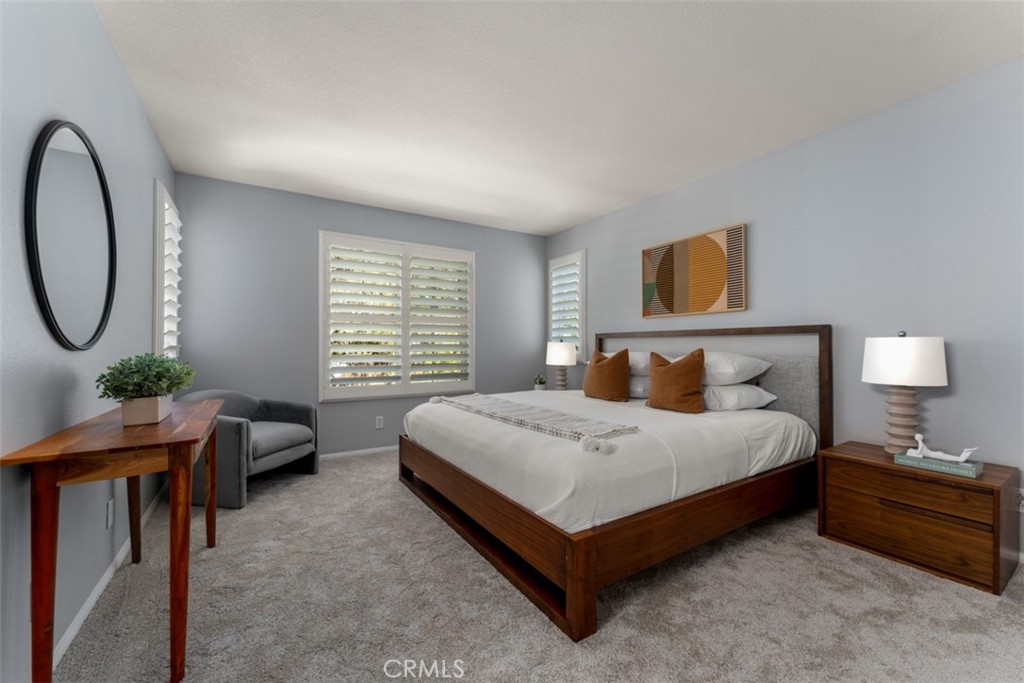 46 Platinum Circle Ladera Ranch, CA 92694 - Photo 22 of 37 a spacious bedroom with a bed a couch and a window