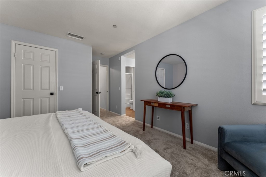 46 Platinum Circle Ladera Ranch, CA 92694 - Photo 24 of 37 a bedroom with a bed a desk and chair