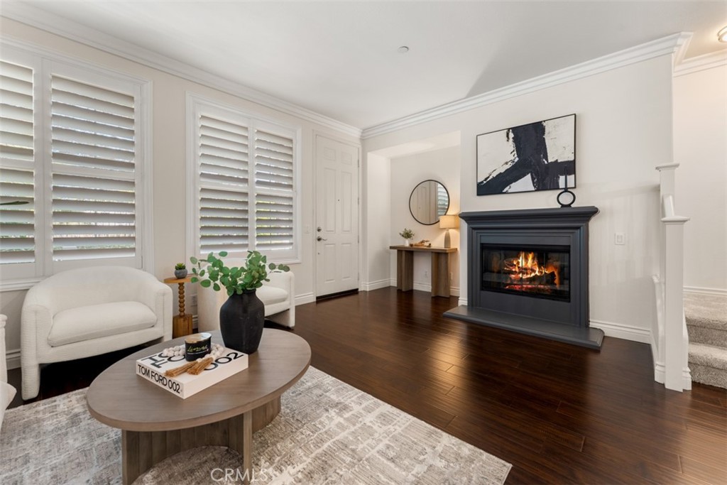 46 Platinum Circle Ladera Ranch, CA 92694 - Photo 7 of 37 a living room with furniture and a fireplace