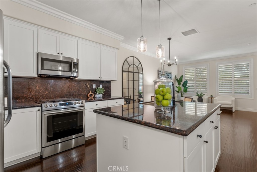 46 Platinum Circle Ladera Ranch, CA 92694 - Photo 10 of 37 a kitchen with stainless steel appliances granite countertop a stove a sink a oven a counter space and cabinets