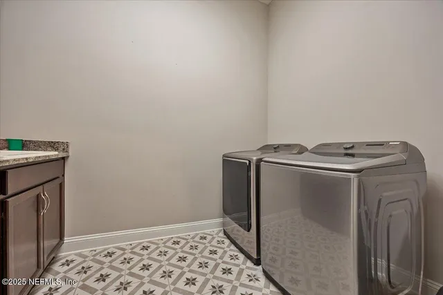 a utility room with dryer and washer