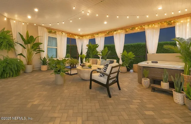 a lobby with furniture and a potted plant