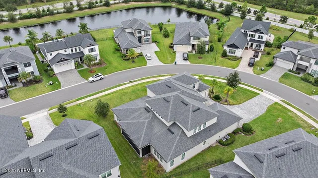 an aerial view of a house with a garden
