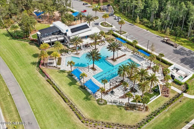 a view of swimming pool with a yard and seating area