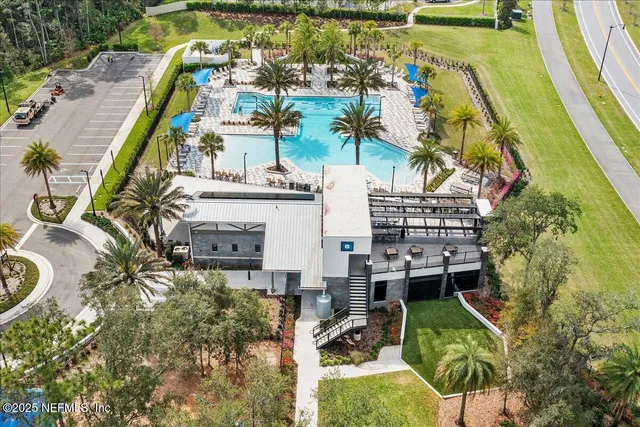 a view of building and yard with swimming pool