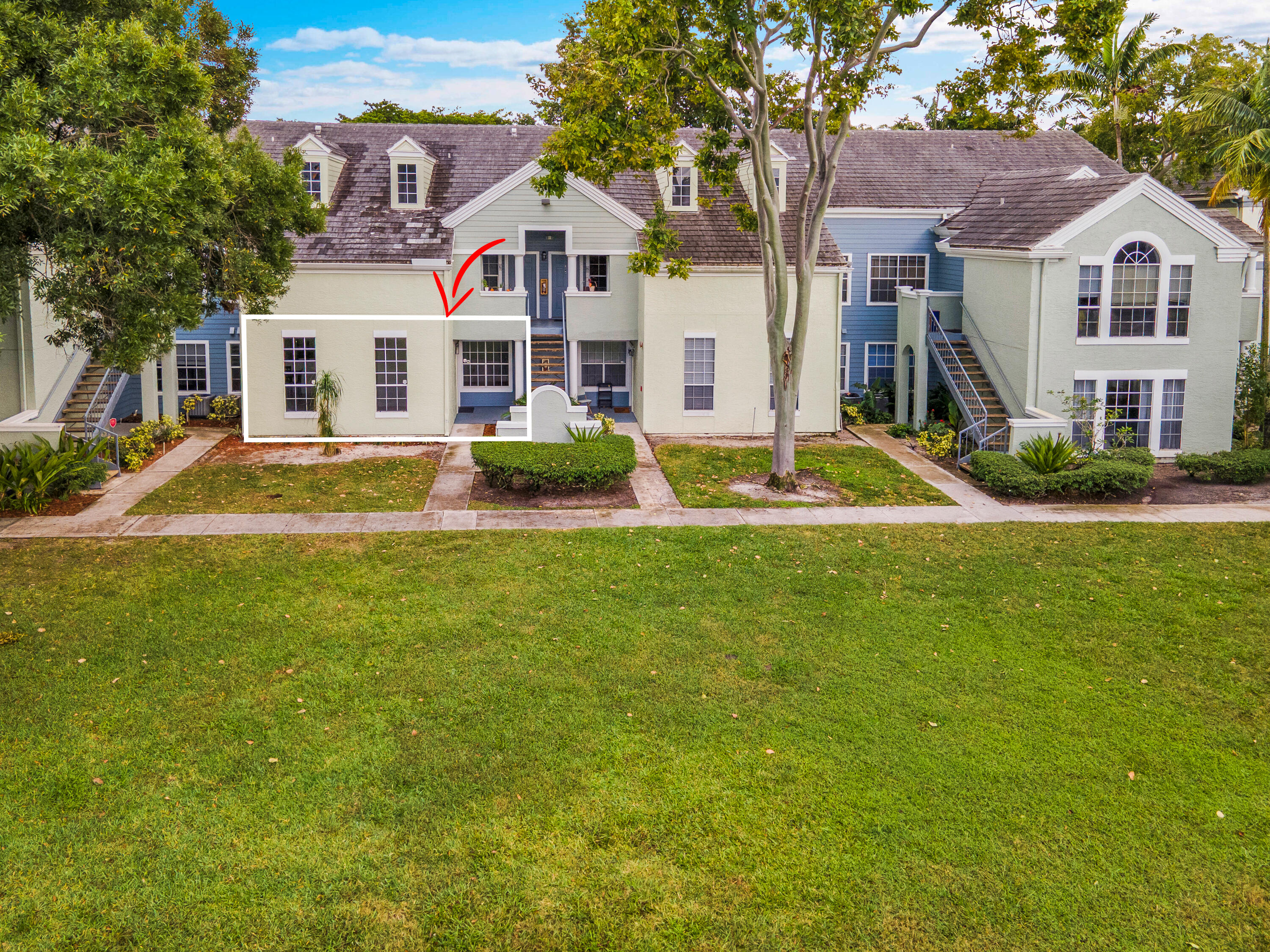 1275 Crystal Way, Unit K Delray Beach, FL 33444 - Photo 1 of 45 a front view of a house with a yard