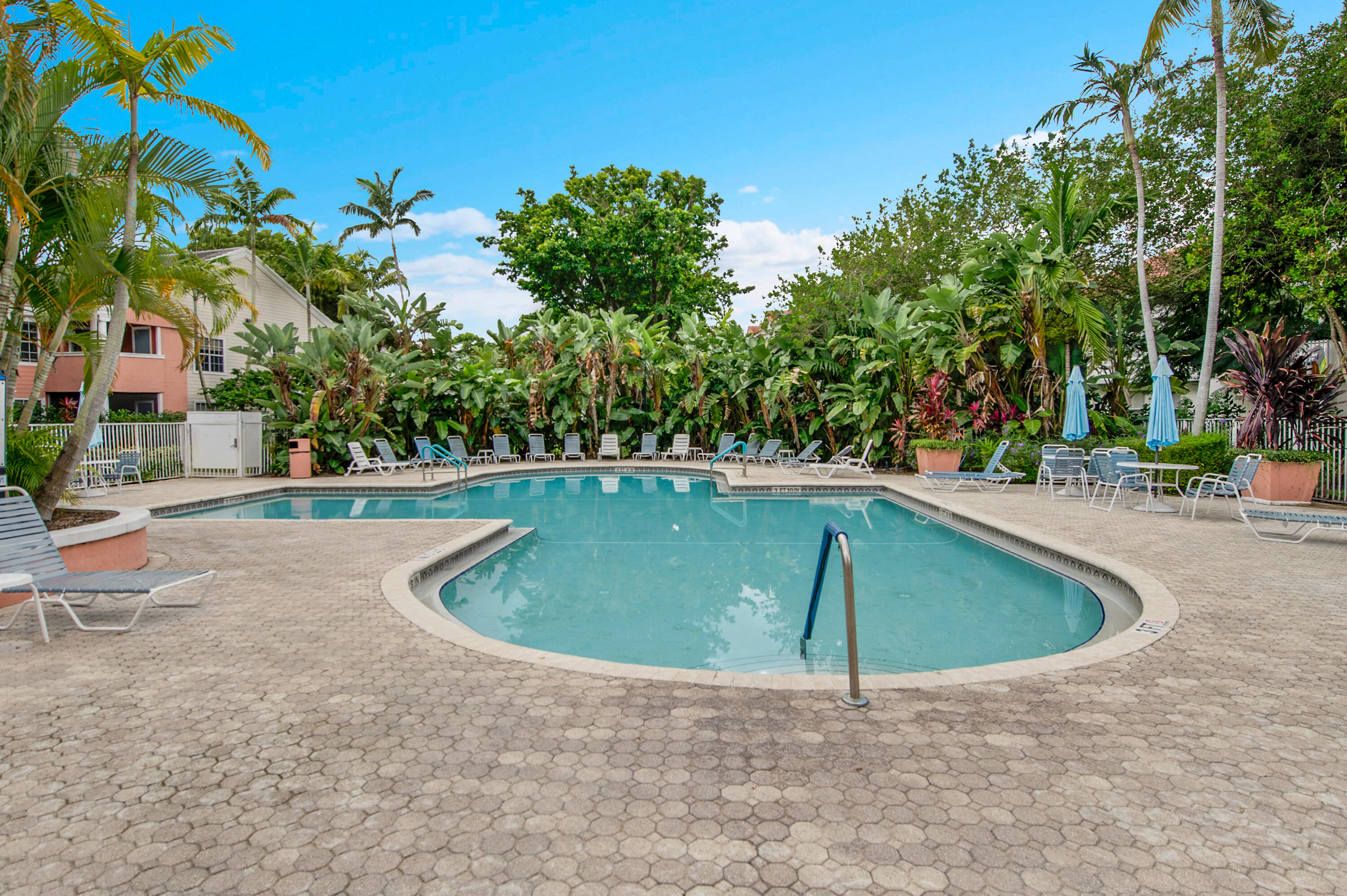 1275 Crystal Way, Unit K Delray Beach, FL 33444 - Photo 33 of 45 a view of outdoor space and swimming pool