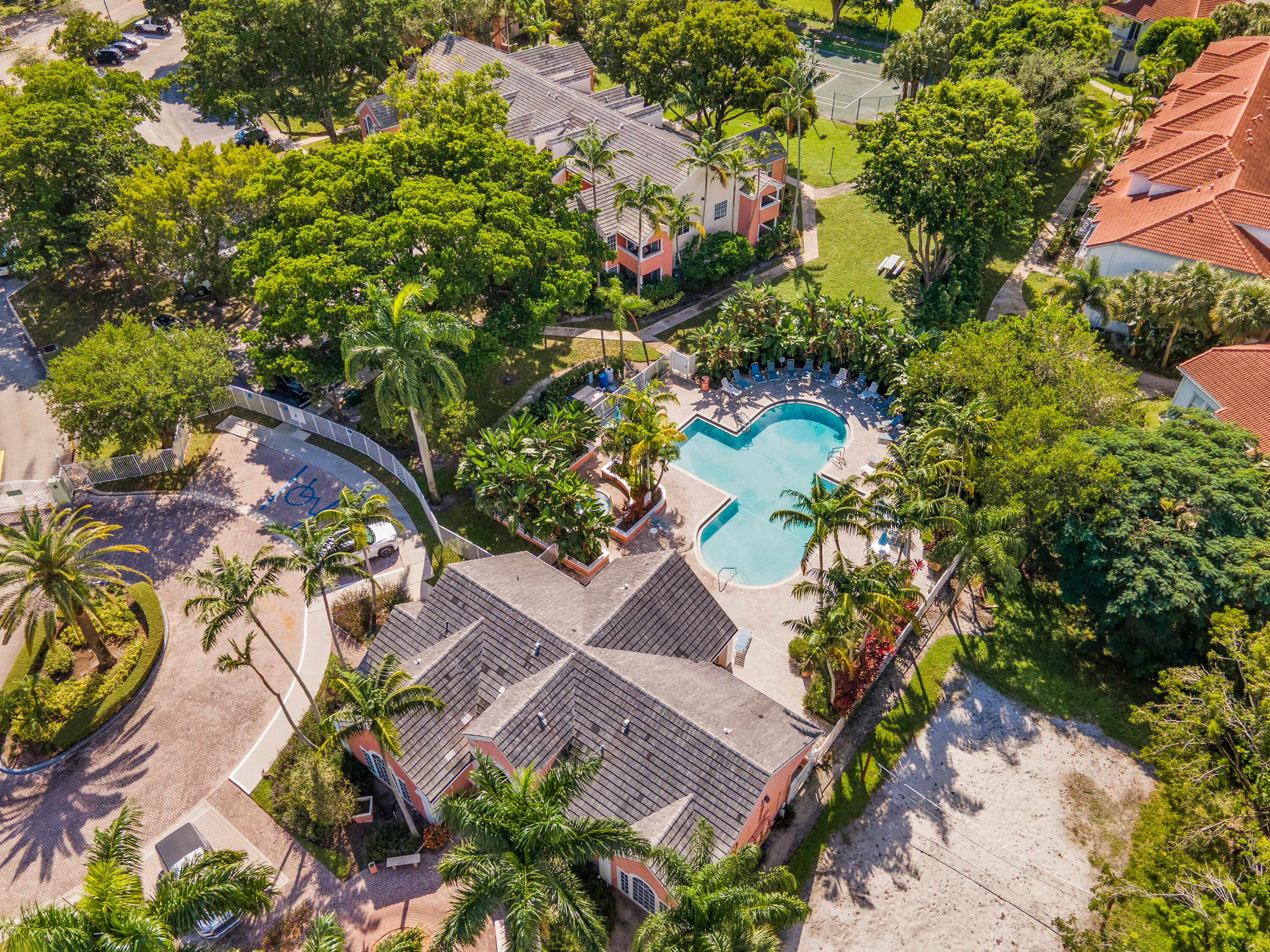 1275 Crystal Way, Unit K Delray Beach, FL 33444 - Photo 43 of 45 an aerial view of a house with a yard and garden