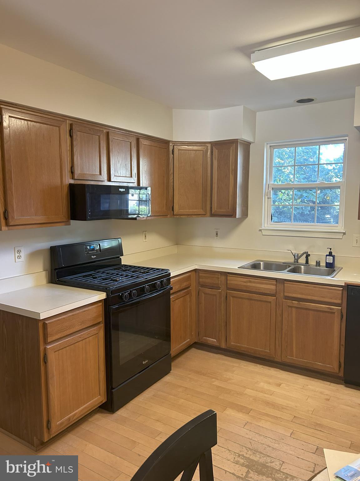 111 Janwall Street Annapolis, MD 21403 - Photo 8 of 32 a kitchen with stainless steel appliances granite countertop a stove a sink and a microwave